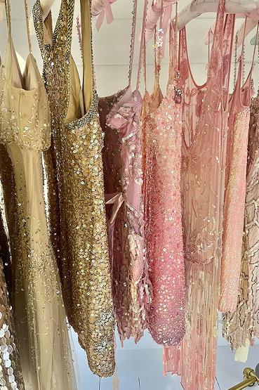 Sequined dresses hanging on a rack