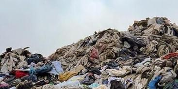 Piles of discarded clothing and textile waste